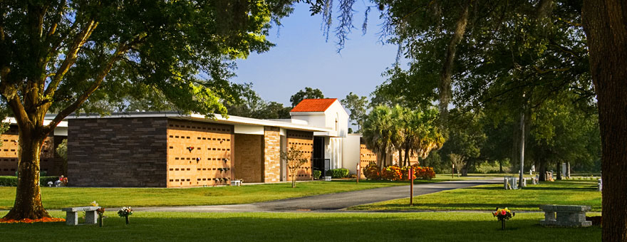 The mausoleums at Calvary Catholic Cemetery during sunset.