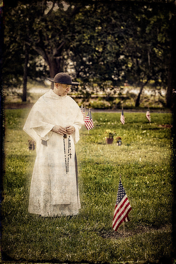 Mercedarian Father Daniel Bowen, Associate Pastor at Sacred Heart Parish in Pinellas Park, prays on his rosary beads as he walks the grounds before Mass on Memorial Day, May 30. | Photo: © 2016 Ed Foster Jr.