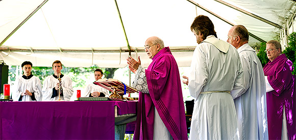 Father Ralph Argentino celebrates Mass on Memorial Day along with concelebrants Father Tim Sherwood and Father Daniel Bowen and assisted by Deacon Peter Andre. | Photo: © 2016 Ed Foster Jr.