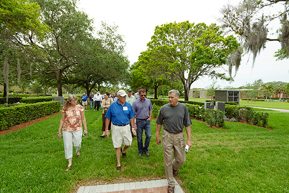 Participants of the Smaller Cemetery Seminar's Site Visit and Tour walk the grounds at Calvary Catholic Cemetery.