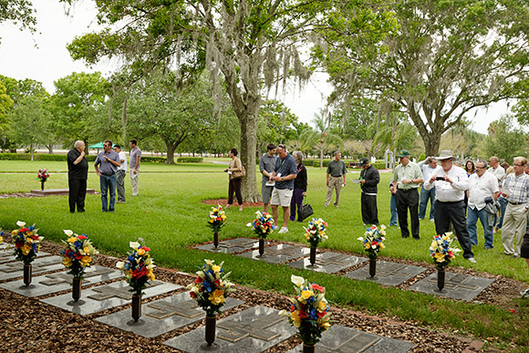 Participants of the Smaller Cemetery Seminar's Site Visit and Tour take notes and make photographs of the priests' burial section at Calvary Catholic Cemetery.