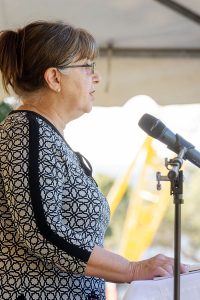 Diane Trumbull proclaims the first reading during Mass on All Souls' Day at Calvary Catholic Cemetery, Clearwater, Fla.