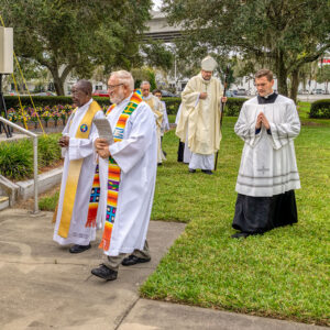 Most Rev. Gregory L. Parkes processes to the outdoor altar for Mass on All Souls' Day at Calvary Catholic Cemetery in Clearwater, Fla.