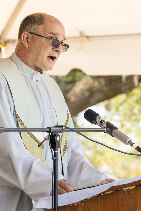 Msgr. Robert Morris proclaims the Gospel during Mass on Memorial Day at Calvary Catholic Cemetery. Msgr. Morris is Vicar General for the Diocese of St. Petersburg and Pastor at St. Catherine of Siena Parish in Clearwater.