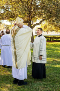 Most Rev. Gregory Parkes and Fr. Ralph D'Elia, III make last minute preparations for Mass on All Souls' Day at Calvary Catholic Cemetery. Fr. D’Elia is Priest Secretary to the Bishop and Chaplain at St. Petersburg Catholic High School.