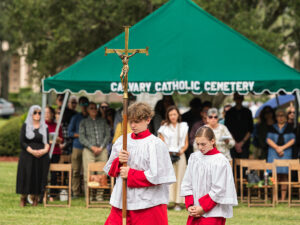 Cathedral of St. Jude the Apostle altar servers lead the procession for the 64th annual Mass on this All Souls’ Day. Msgr. John P. McNulty celebrated the first Mass at the outdoor altar on November 2, 1961 and this tradition has continued annually on All Souls’ Day and Memorial Day. Mass for the repose of souls is also celebrated on the last Saturday of every month in the Chapel of the Resurrection at 10:00 a.m.
