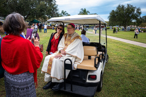At the conclusion of the Mass and prayers at the priests’ gravesites, there are always many of the faithful eager to greet the bishop and have their photograph made with him.